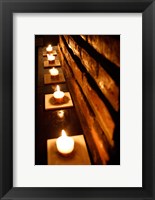 Framed Lighted Candles and Brick Wall