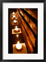Framed Lighted Candles and Brick Wall