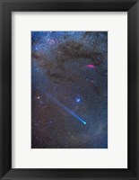 Framed Comet Lovejoy's long ion tail in Taurus