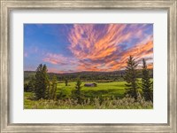 Framed Sunset over a Log Cabin