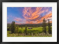 Framed Sunset over a Log Cabin