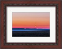 Framed Moon and Venus rising over the flat prairie horizon of Alberta, Canada