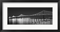 Framed Bay Bridge lit up at night, San Francisco, California