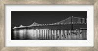 Framed Bay Bridge lit up at night, San Francisco, California