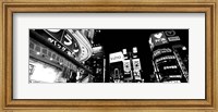 Framed Low angle view of buildings lit up at night, Tokyo, Japan