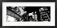 Framed Low angle view of buildings lit up at night, Tokyo, Japan