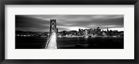 Framed Bridge lit up at dusk, Bay Bridge, San Francisco, California