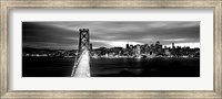 Framed Bridge lit up at dusk, Bay Bridge, San Francisco, California