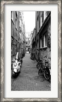 Framed Scooters and bicycles parked in a street, Amsterdam, Netherlands