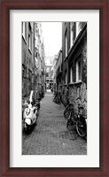 Framed Scooters and bicycles parked in a street, Amsterdam, Netherlands