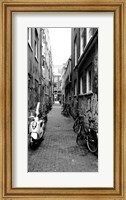 Framed Scooters and bicycles parked in a street, Amsterdam, Netherlands