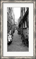 Framed Scooters and bicycles parked in a street, Amsterdam, Netherlands