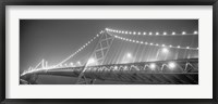 Framed Suspension bridge lit up at night, Bay Bridge, San Francisco, California