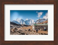 Framed Trekkers and yaks in Lobuche on a trail to Mt Everest