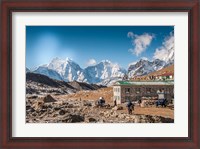 Framed Trekkers and yaks in Lobuche on a trail to Mt Everest