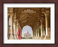 Framed Woman in traditional Sari walking towards Taj Mahal