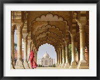 Framed Woman in traditional Sari walking towards Taj Mahal