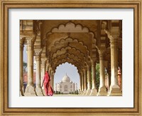 Framed Woman in traditional Sari walking towards Taj Mahal