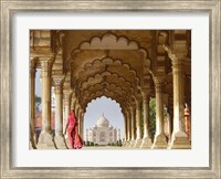 Framed Woman in traditional Sari walking towards Taj Mahal