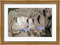Framed Two F/A-18E Super Hornets conduct a fly by of Mount Rushmore