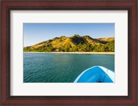 Framed Blue boat cruising through the Yasawa, Fiji, South Pacific
