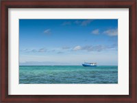 Framed Fishing boat in the turquoise waters of the blue lagoon, Yasawa, Fiji, South Pacific