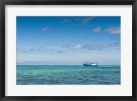 Framed Fishing boat in the turquoise waters of the blue lagoon, Yasawa, Fiji, South Pacific