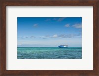 Framed Fishing boat in the turquoise waters of the blue lagoon, Yasawa, Fiji, South Pacific