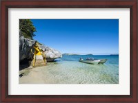 Framed Little motorboats anchoring before the Sawa-I-Lau Caves, Yasawa, Fiji, South Pacific