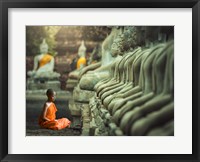 Framed Young Buddhist Monk praying, Thailand