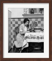 Framed 1920s Woman Sitting At Kitchen Table
