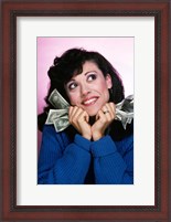 Framed Excited Brunette Woman Holding Several Dollar Bills