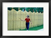 Framed 1980s Smiling Boy Running Along Sidewalk