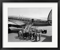 Framed 1950s Group Of Passengers Boarding Airplane