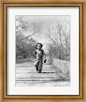 Framed 1940s Boy Walking Down Country Road
