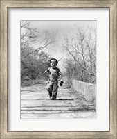 Framed 1940s Boy Walking Down Country Road