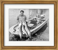 Framed 1970s Man In Small Motorboat