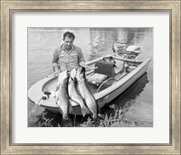 Framed 1970s Man In Small Motorboat