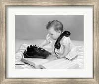 Framed 1960s Baby Girl With Telephone Book