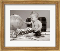 Framed 1960s Baby Seated Looking At Globe