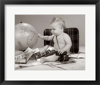 Framed 1960s Baby Seated Looking At Globe