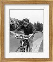 Framed 1930s Smiling Boy Riding Bicycle