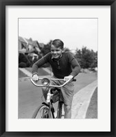 Framed 1930s Smiling Boy Riding Bicycle