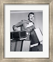 Framed 1950s Smiling Bellboy Carrying Four Bags Of Luggage