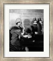 Framed 1920s  Woman With Pen To Lips Wearing Cloche Hat