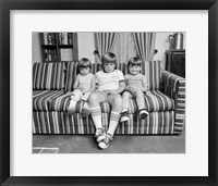 Framed 1970s Three Siblings Sitting On Couch