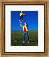 Framed 1990S Father Tossing Daughter Up In The Air