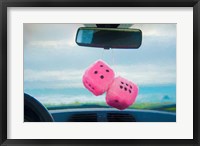 Framed Furry Dice Hanging in a Car